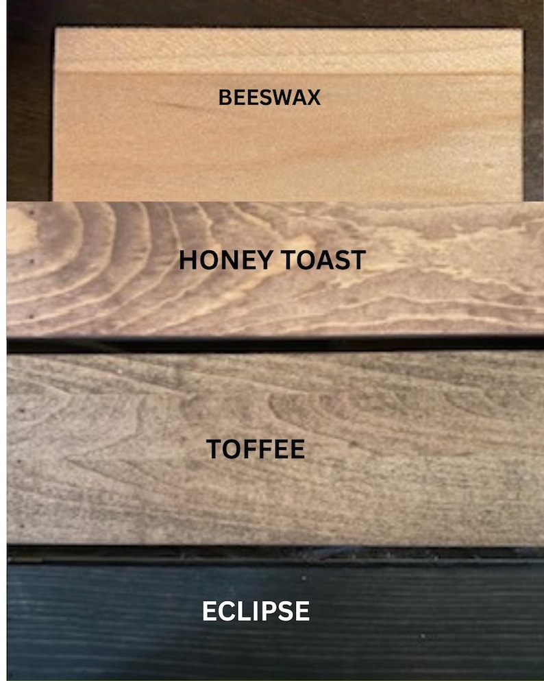 May include: Four rectangular wooden planks arranged vertically, each displaying a distinct wood stain color. The labels BEESWAX, HONEY TOAST, TOFFEE, and ECLIPSE are printed in black text on the corresponding light, medium, and dark wood surfaces.
