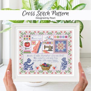 Könnte beinhalten: Ein gerahmtes Kreuzstichmuster mit dem Text "Cross Stitch Pattern" und "Designed by Pearl". Das Kreuzstichdesign enthält die Worte "Count Your Blessings" und ein Zitat. Der Rahmen ist weiß, und der Hintergrund ist eine Pflanze.