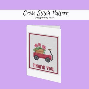 May include: A white greeting card with a cross-stitch design of a red wagon filled with pink flowers. The words "THANK YOU" are stitched below the wagon. The card also has the text "Cross Stitch Pattern Designed by Pearl".