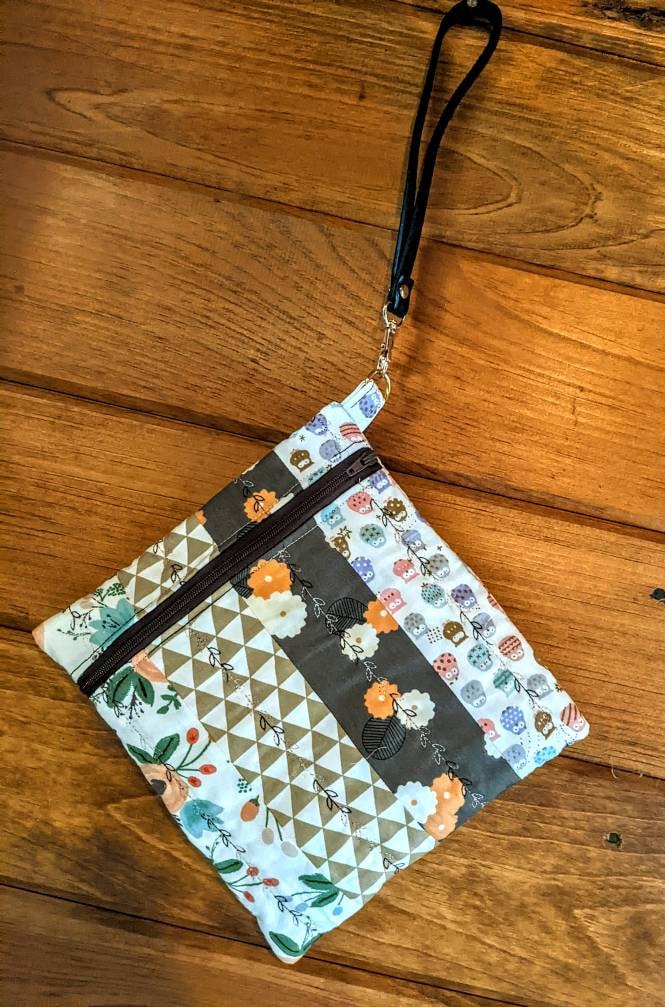 Wristlet bag with flowers and owls