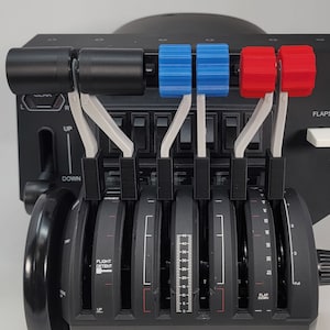 May include: A black flight simulator throttle quadrant with six levers. The levers have white handles and are topped with black, blue, and red knobs. The panel has various switches and labels, including "FLIGHT DETENT" and "FLAP DOWN".