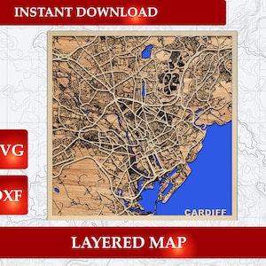May include: A layered wooden map of Cardiff featuring intricate street networks in light brown wood tones contrasted against a vibrant blue water section. The design includes the text CARDIFF in the bottom right corner, with SVG and DXF labels.