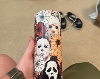 Vaso con flores e iconos de terror de Halloween