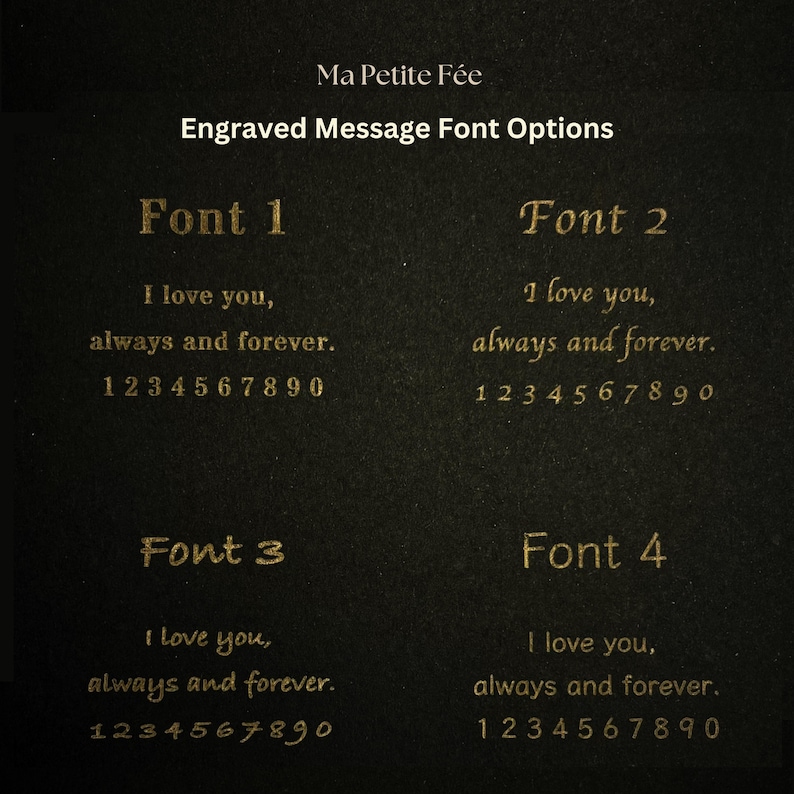 May include: A black display card titled Ma Petite F&eacute;e Engraved Message Font Options, showcasing four distinct gold-colored font styles. Each section displays the text I love you, always and forever, followed by the numbers 1 through 0.