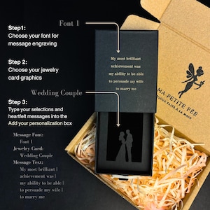 May include: A black rectangular jewelry gift box with a sliding lid, featuring gold text that reads: My most brilliant achievement was my ability to be able to persuade my wife to marry me, and a silhouette graphic of a wedding couple.