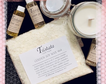 May include: A bag of white soy wax flakes with a label that reads "Tristate Candle Supply Golden Soy Wax 464". The label includes instructions for using the wax to make candles. There are also four small bottles of essential oils with labels that read "Tristate Candle Supply" and various scents.