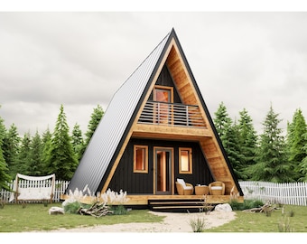 May include: A black and wood A-frame house with a balcony and a white picket fence in front. The house has a metal roof and large windows. There are two chairs on the porch.