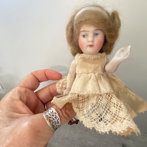 Mini-Bisque Doll, Tea-Cup Doll, hand painted face,  Kewpie Doll, circa 1920, original hair, Collector Quality Doll, 5”H x 2” wide, RARE