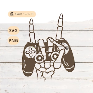 Può includere: Una mano scheletrica che tiene un controller per videogiochi con le dita indice alzate in un gesto rock and roll.
