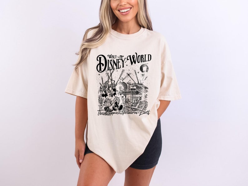 a woman wearing a disney world t - shirt