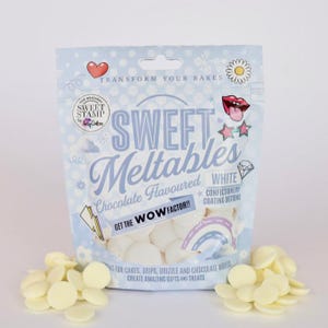 May include: A bag of white chocolate melts, labelled "Sweet Meltables" with the text "Chocolate Flavoured White Confectionery Coating Buttons". The bag has a cartoon design with a heart, a daisy, and a rainbow. The bag is open and white chocolate melts are spilling out.