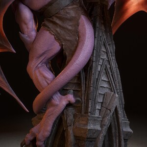 May include: A detailed statue of a purple gargoyle with leathery wings and a tattered brown garment. The gargoyle is perched on a weathered stone structure, with sharp claws and a long tail. The statue has a detailed, textured appearance.