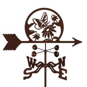 May include: A brown metal garden weather vane with a butterfly and flower design. The vane has a compass rose with the letters N, S, E, and W. The arrow points to the east.