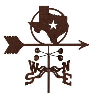 May include: A brown metal Texas state-shaped wind vane with a star in the center, mounted on a pole with a compass rose and four metal balls.