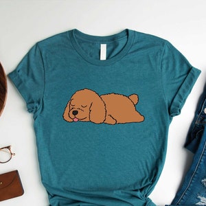 a shirt that has a dog on it