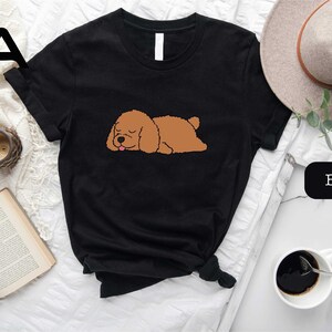 a black shirt with a brown dog on it