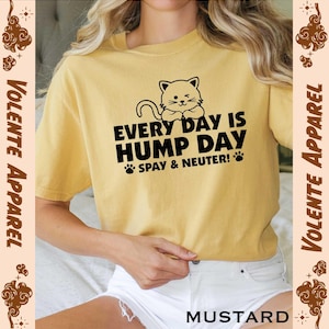 May include: A yellow t-shirt with a black cat illustration and the text "Every Day is Hump Day Spay & Neuter!"