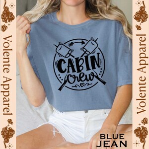 a woman wearing a t - shirt that says cabin crew