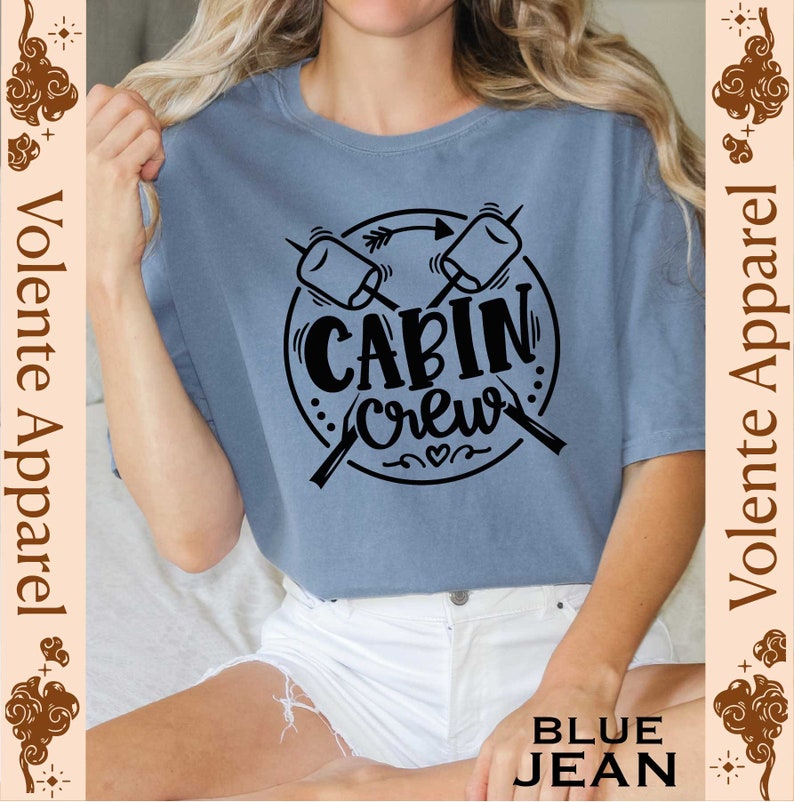 a woman wearing a t - shirt that says cabin crew