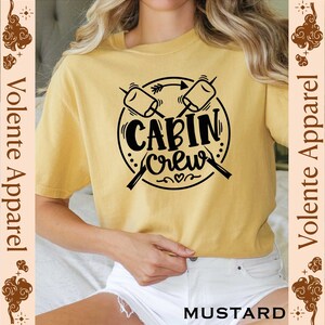 a woman wearing a t - shirt that says cabin crew