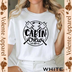 a woman wearing a t - shirt that says cabin crew