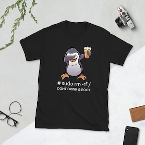 May include: Black t-shirt with a cartoon penguin holding a beer and the text '# sudo rm -rf / DONT DRINK & ROOT'.