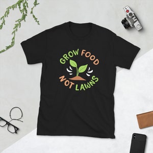 May include: Black t-shirt with a green plant graphic and the text "Grow Food Not Lawns" in a circle.
