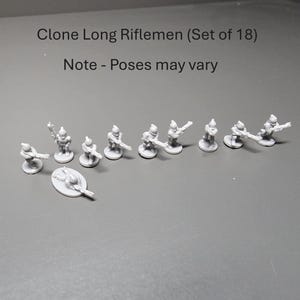 May include: A collection of 18 miniature Clone Long Riflemen figures in light grey. The figures are posed with rifles. Text reads "Clone Long Riflemen (Set of 18)" and "Note - Poses may vary".