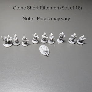 May include: A collection of 18 miniature Clone Short Riflemen figures. The figures are light grey and are on small, round bases. The text "Clone Short Riflemen (Set of 18)" and "Note - Poses may vary" are visible.