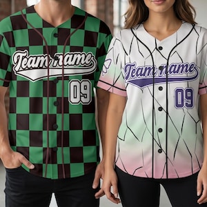 May include: Two button-down baseball jerseys. The left jersey features a green and black checkerboard pattern with the text Team name and the number 09. The right jersey has a white, green, and pink gradient with black lines, a butterfly icon, the text Team name, and the number 09.