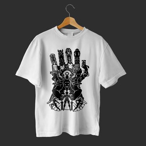 May include: White t-shirt with a black graphic of a hand with the Avengers characters forming the gauntlet.