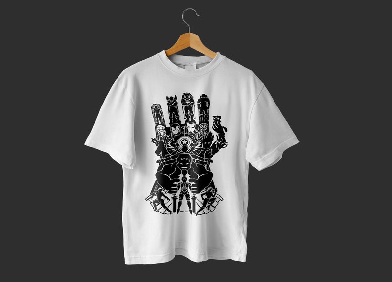 May include: White t-shirt with a black graphic of a hand with the Avengers characters forming the gauntlet.