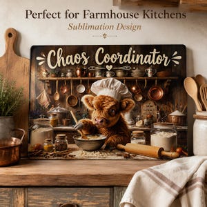 May include: A rectangular sign featuring a brown highland calf wearing a white chef hat, stirring a bowl with a wooden spoon. The text 'Chaos Coordinator' is printed above the calf, set against a rustic kitchen background with shelves.