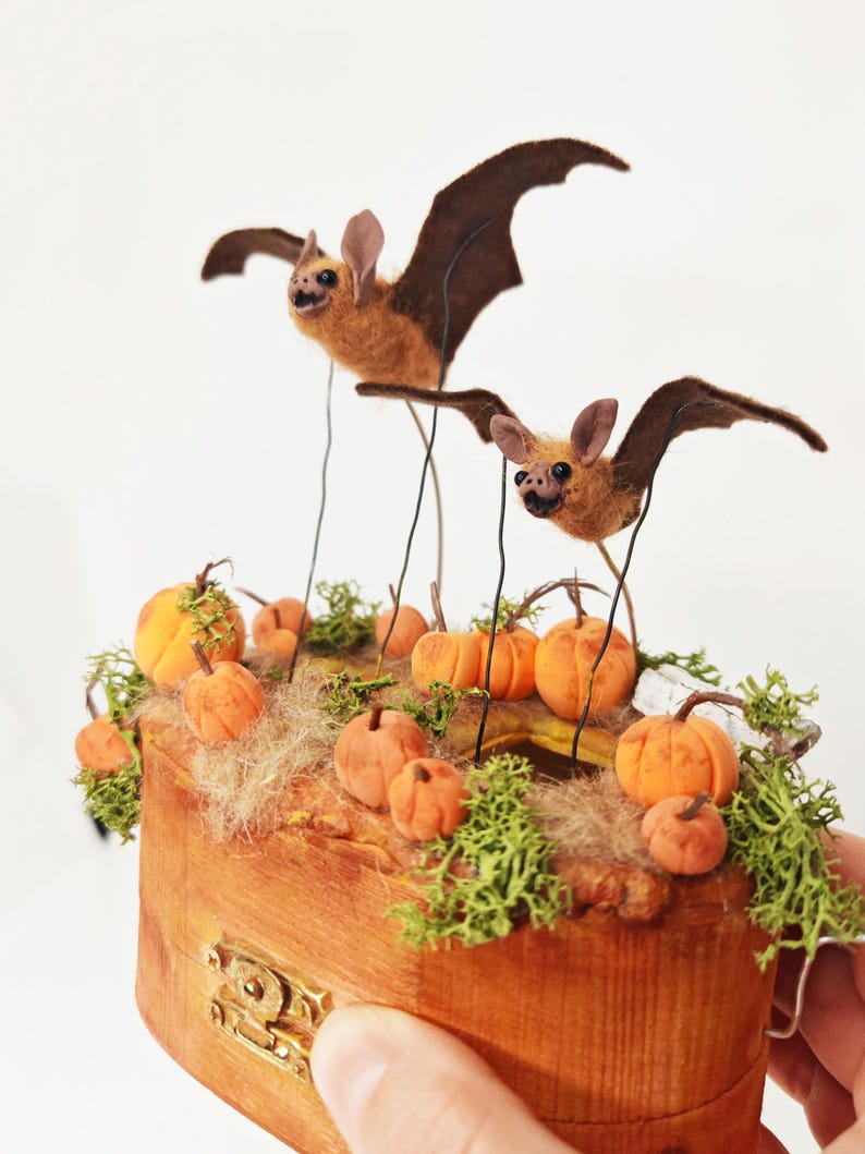 Two Little Bats Flying Over a Pumpkin Patch Automata, Mechanical ...