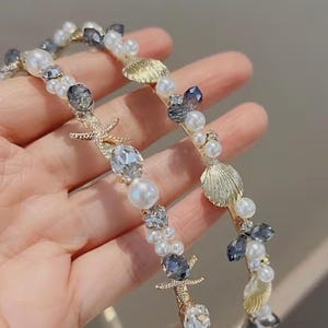 Diadema adornada con conchas marinas o estrellas de mar y perlas, diadema con decoración de cristal metálico. imagen 3