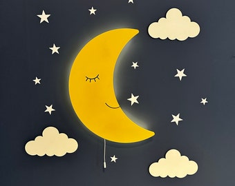 May include: A yellow crescent moon wall light with a smiling face and closed eyes. The moon is surrounded by white clouds and stars on a dark blue background.