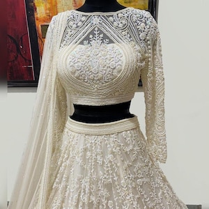 Sabyasachi Designer Heavy Georgette Lehenga Choli for Indian Wedding with White Chaniya Choli.