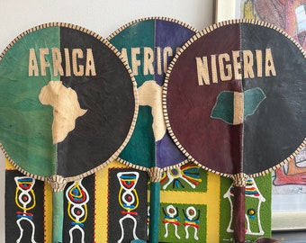 Intricately designed leather African hand fans