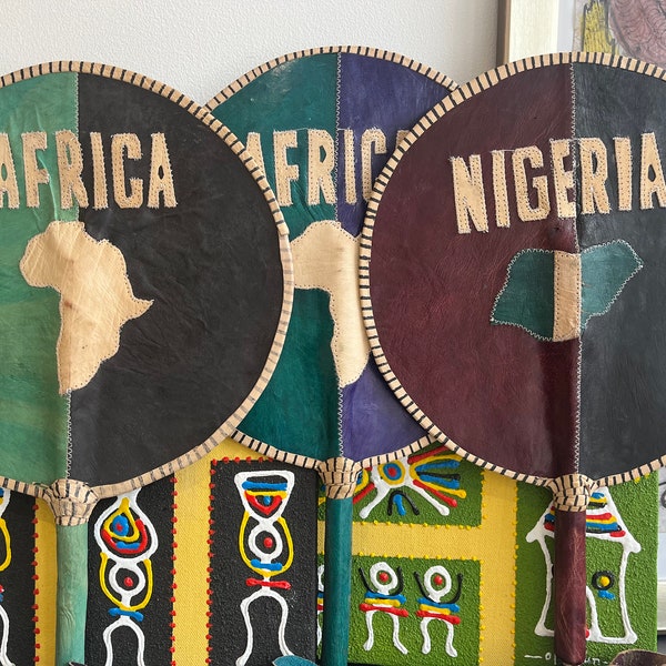 Intricately designed leather African hand fans
