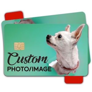 May include: A rectangular credit card featuring a custom photo of a white chihuahua wearing a rhinestone collar against a teal background. The card includes a gold EMV chip and the black text Custom PHOTO/IMAGE printed on the front surface.