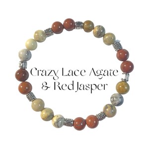 May include: A beaded bracelet featuring alternating round Crazy Lace Agate and Red Jasper stones, interspersed with small, textured silver-toned metal spacers. The text Crazy Lace Agate & Red Jasper is centered within the circular arrangement.