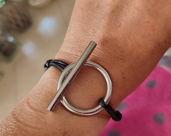 Pretty adjustable cord bracelet with large barred ring in Stainless Steel