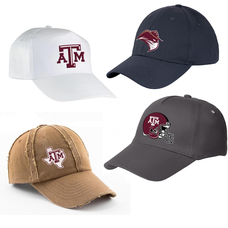 May include: Four baseball caps in white, navy, brown, and gray. Each cap features a logo or emblem, including the letters "A&M" in maroon, a stylized bird, a Texas outline with "A&M", and a maroon football helmet with "A&M".