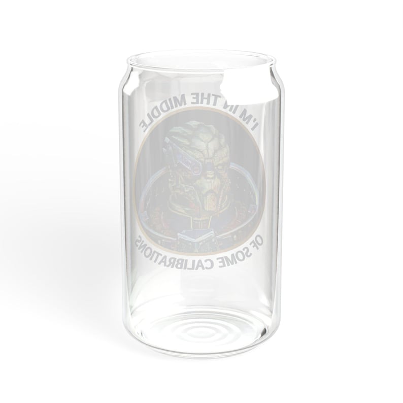 A 16oz clear glass with a stylized image of Garrus from Mass Effect, framed in a circle with the quote “I’m in the middle of some calibrations” in bold, sci-fi inspired font.