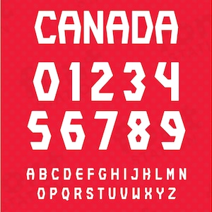 May include: White font on a red background with the word "CANADA" at the top, followed by the numbers 0-9, and then the letters of the alphabet in uppercase.