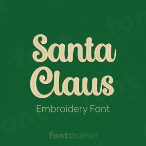 May include: A green background with the words "Santa Claus" in a cream-coloured, cursive font. Below the words, it says "Embroidery Font" in a smaller, sans-serif font. The website "fontstation" is at the bottom.