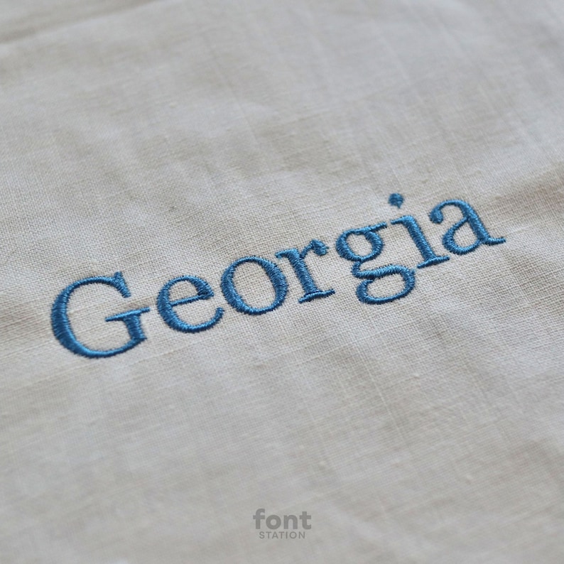 Image showing a word embroidered on textile using the Georgia embroidery font created by FontStation