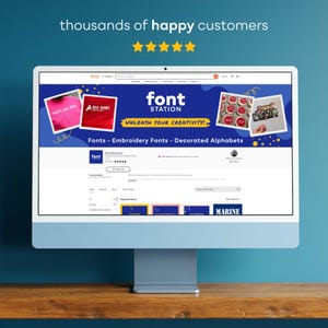 May include: A computer monitor displays the Etsy shop "Font Station." The shop's banner features the text "font STATION" and "UNLEASH YOUR CREATIVITY!" with examples of fonts and embroidery. The screen also shows customer reviews and the words "A RED SHIRT."