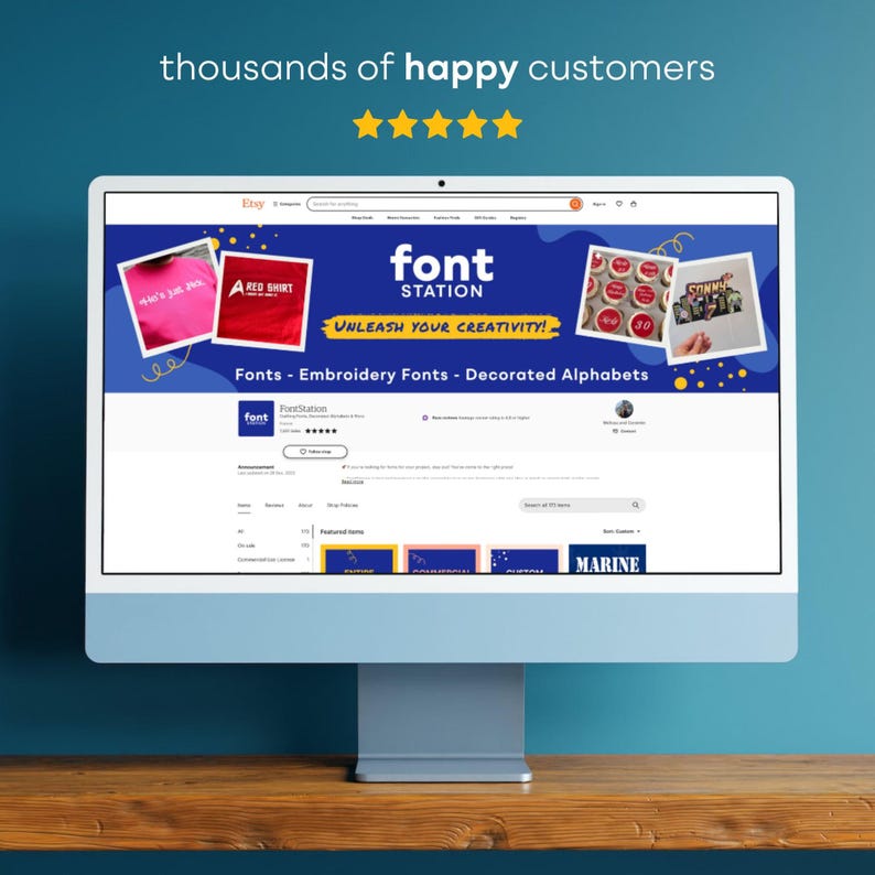 May include: A computer monitor displays the Etsy shop "Font Station." The shop's banner features the text "font STATION" and "UNLEASH YOUR CREATIVITY!" with examples of fonts and decorated alphabets. The screen shows customer reviews and featured items.