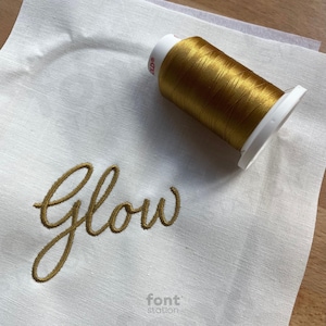 Embroidered letters using the Signature embroidery font created by FontStation